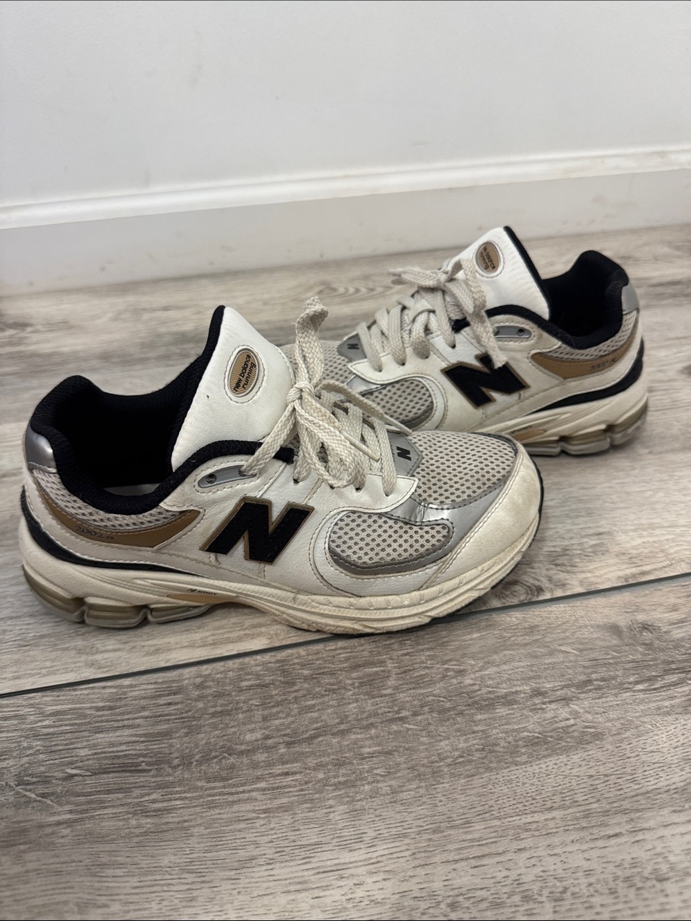 New Balance Kids Cream and Black Sneaker with Tan Accents